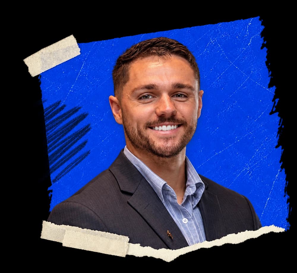 Dalton Schwentker smiling, photographed in a paper collage with blue brushstrokes and tape